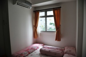 Kamar tidur utama NH Apartment